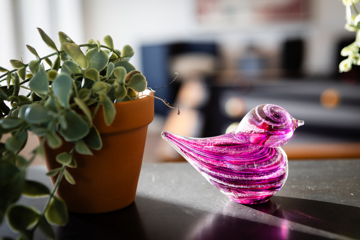 glass bird with cremation ash